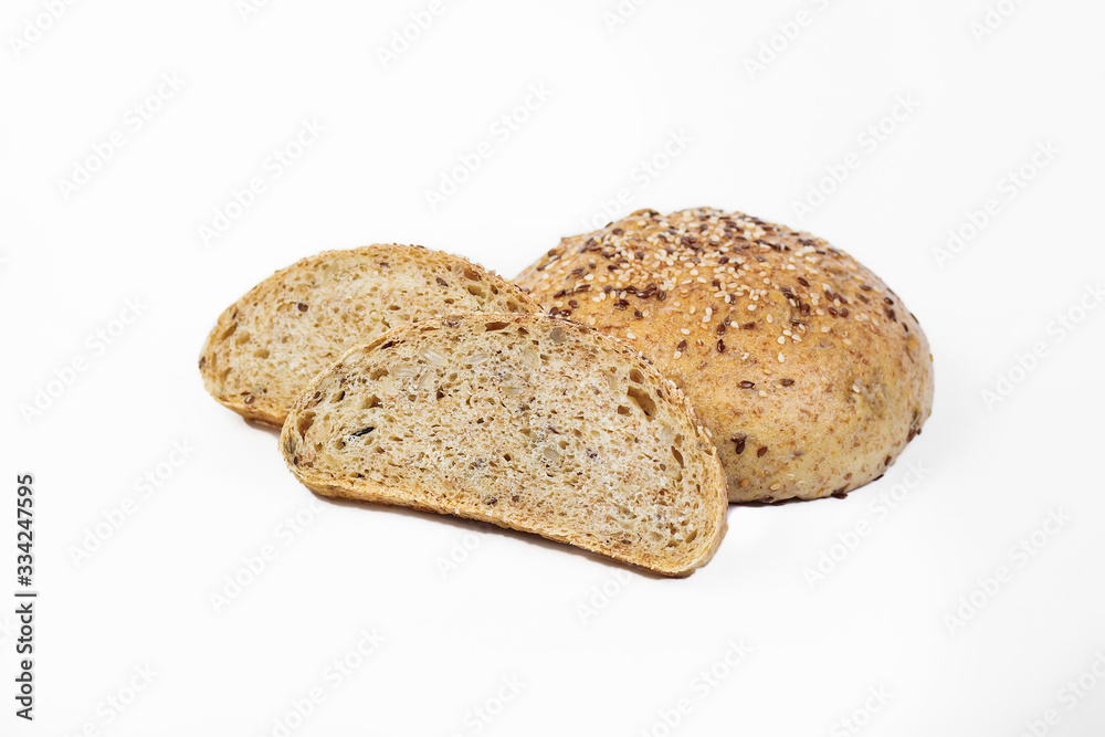 Fresh bakery product. Bread. Sesame seedless yeast isolated on white background. Top view and copy space for text. Fresh bakery product. Bread. Sesame seedless yeast isolated on white background. Top view and copy space for text.