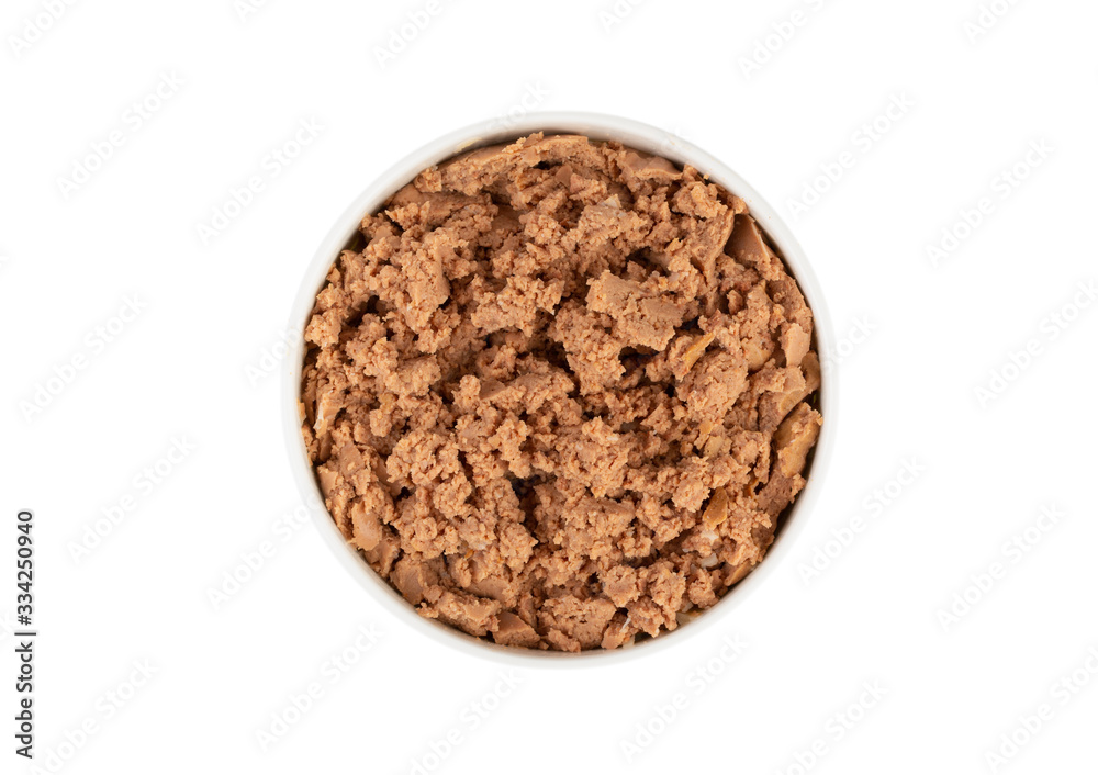 Canned pet food in round white bowl isolated on white, top view. Canned pet food in round white bowl isolated on white, top view.