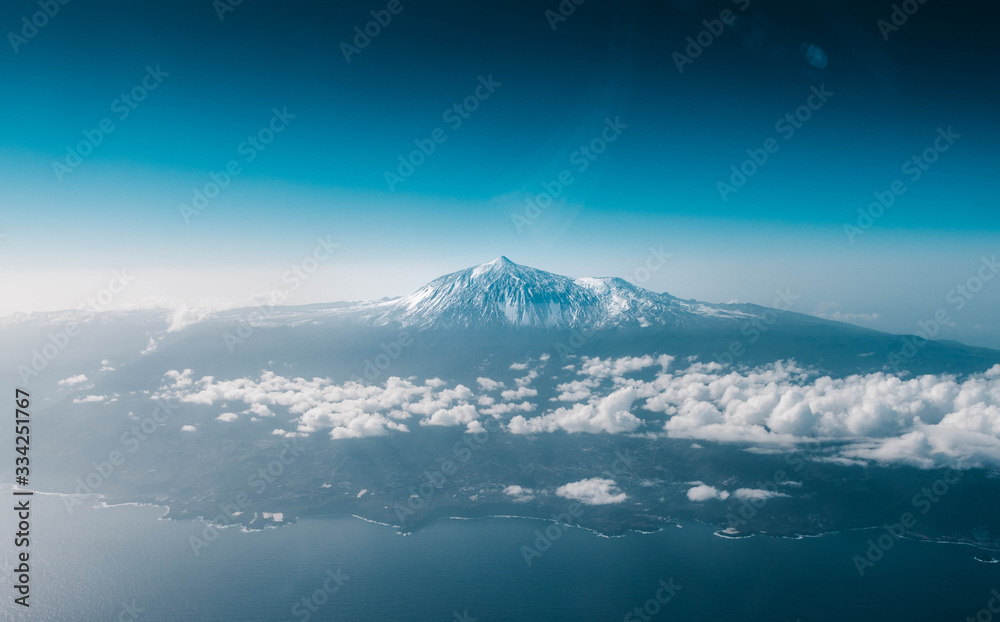 Snowed volcano seen from an aircraft in flight