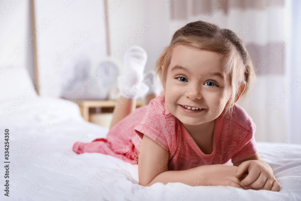 Cute little girl on bed at home Cute little girl on bed at home