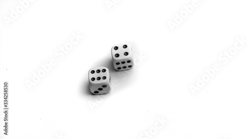 White dice isolated. On white background with shadow. 