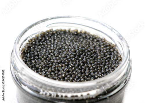 Black sturgeon caviar on a white background.