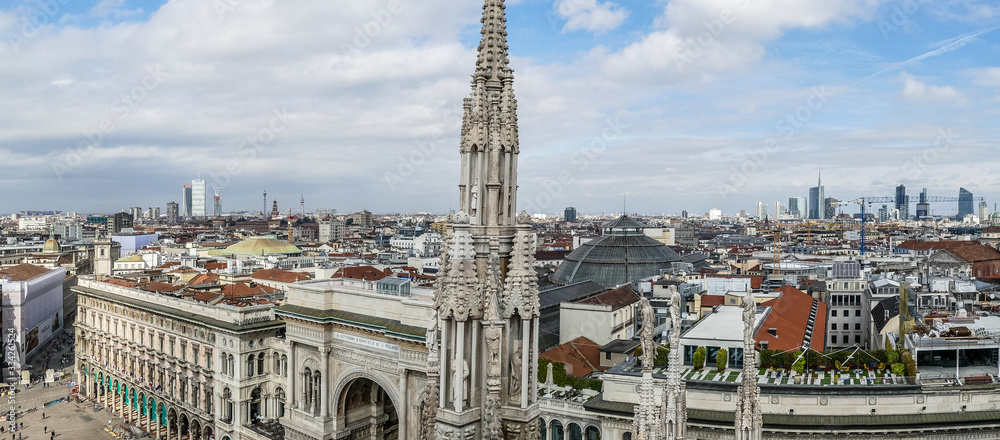 Fototapeta premium The Milan skyline from the Duomo terrace