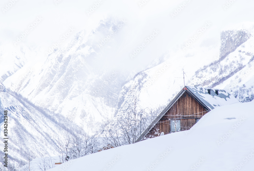 Lonely wooden cabin hidden in the mountains. Winter holidays destination in Georgia.2020