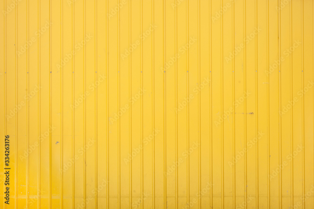 Closeup of yellow corrugated steel panel - obrazy, fototapety, plakaty 