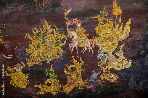 Gold color of old mural is the story of Ramakian ,Ancient fresco at Wat Phra Kaew temple in Bangkok, Thailand