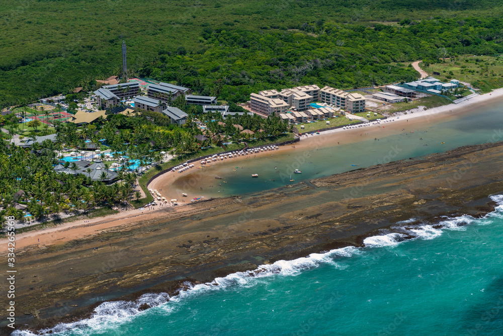 Luxury resorts in Muro Alto beach, Porto de Galinhas, near Recife, Pernambuco, Brazil on March 1, 2014. In the background, the port of Suape. Aerial