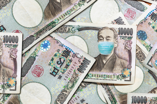 Face mask yen banknote. Business concept of Covid 19 virus pandemic in Japan. Coronavirus outbreak and the Japanese money market. Fukuzawa Yukichi founder of Institute for Study of infectious diseases photo