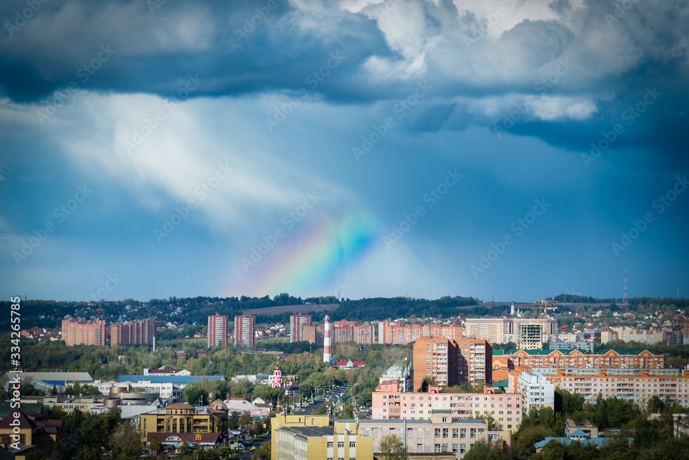 panorama of the city with rainbow and sun panorama of the city with rainbow and sun