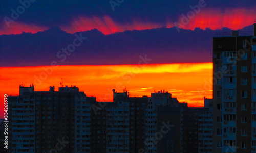 Evening city with red sky