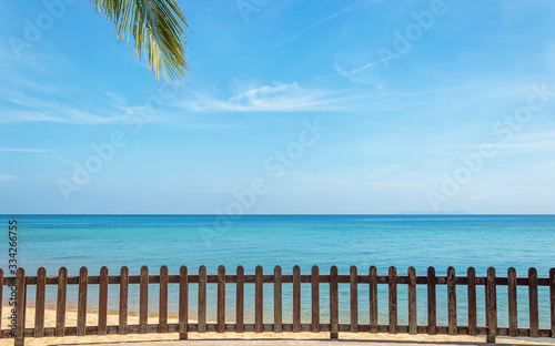 Wooden railing facing to blue ocean