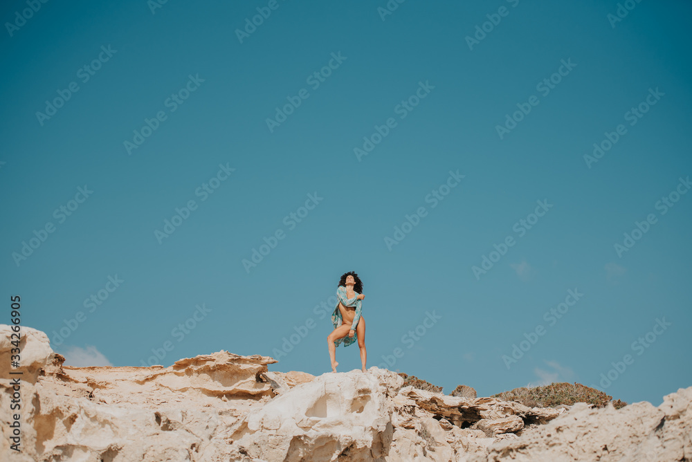 Sexy woman in the rocks