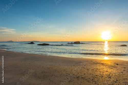 Fototapeta Naklejka Na Ścianę i Meble -  Beach wave with orange sunrise background