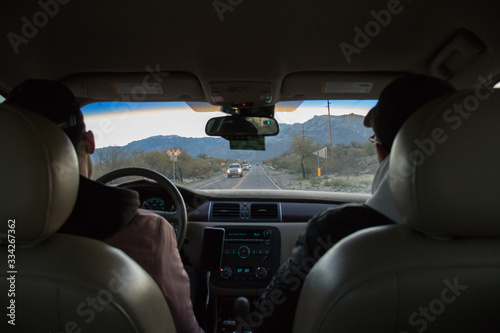 driving in a car towards mountains © Gabe