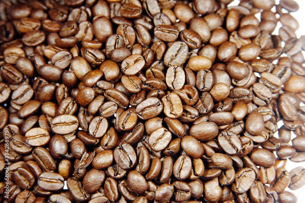 Roasted coffee beans on a table Roasted coffee beans on a table