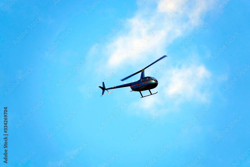 Fototapeta premium Helicopter in the blue sky