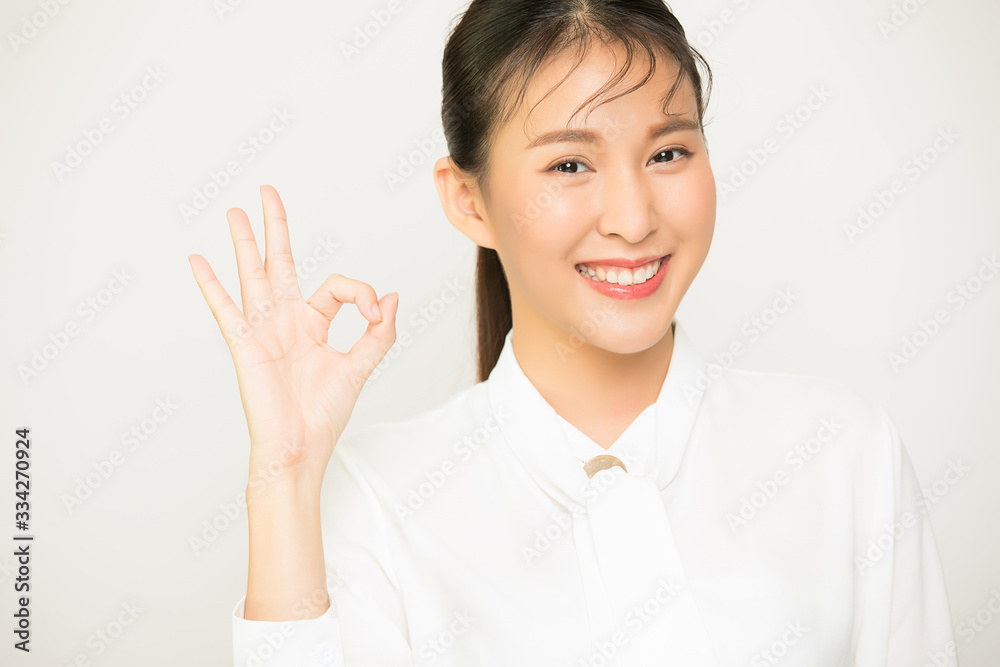 Asia girl with, showing okay excellent gesture and smiling, say yes, confirm or recommend something, white background Asia girl with, showing okay excellent gesture and smiling, say yes, confirm or recommend something, white background
