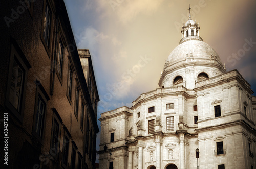 Exterior view with sunset cloudy sky of the white dome and facade of the Pantheon in Lisbon, Portugal, national monument with the tombs of many famous personalities of portuguese history and culture photo