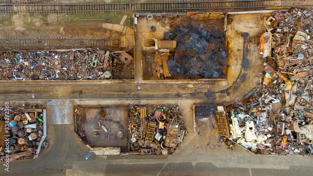 Sorting and recycling of metal waste top view. Scrap metal procurement station. Loading operations for the utilization of ferrous metals by air shooting.