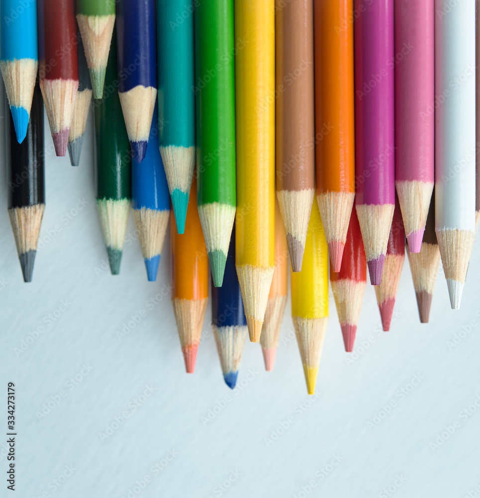 stacked colored pencils on white background stacked colored pencils on white background