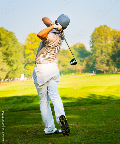 golfer putting on green