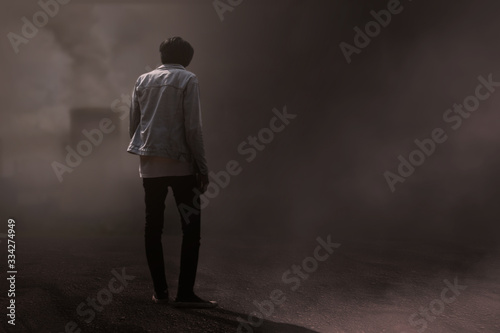 back view Sinister figure wih background spooky forest 