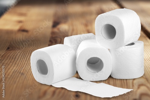 Rolls of white toilet paper on the table