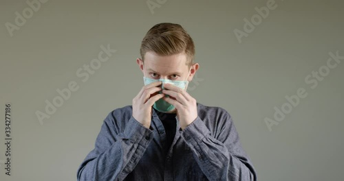 European Man Putting On Face Mask B photo