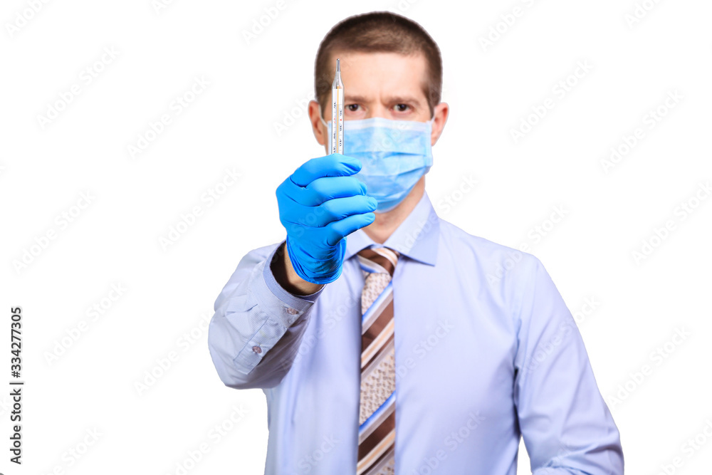 Man wearing rubber gloves, medical mask on his face, shows on a degree bar isolated Man wearing rubber gloves, medical mask on his face, shows on a degree bar isolated