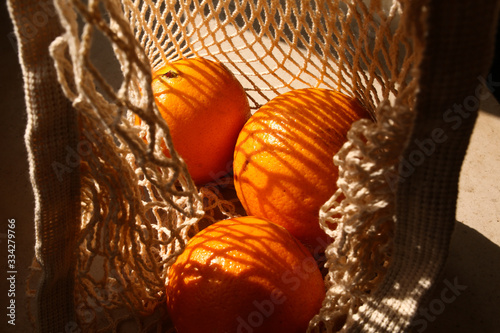 no plastic eco string bag with oranges fruits healthy food diet vitamins