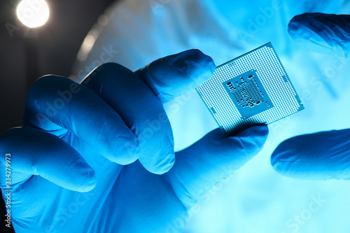 Bilde på lerret Close-up gloved hands holding detail microchip