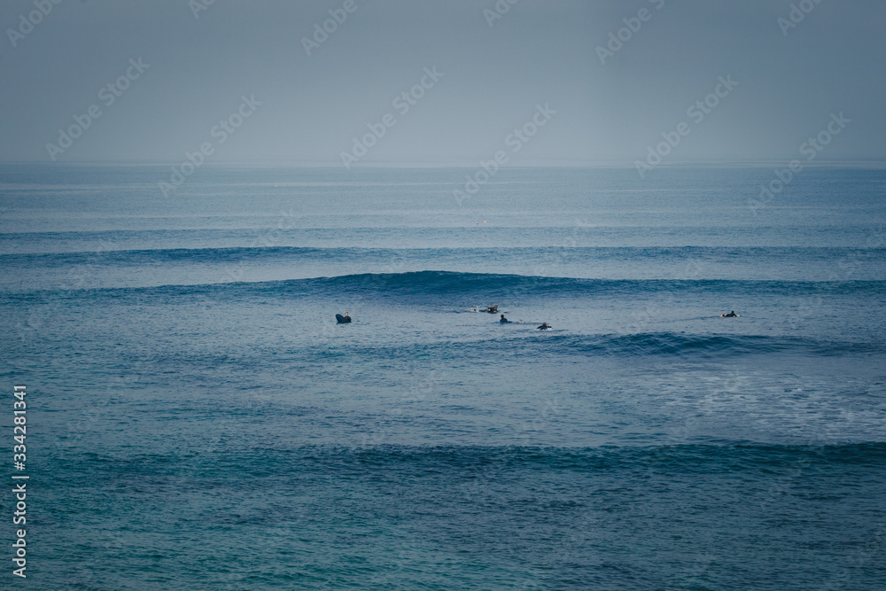 Surfers waiting for their turn in the lineup