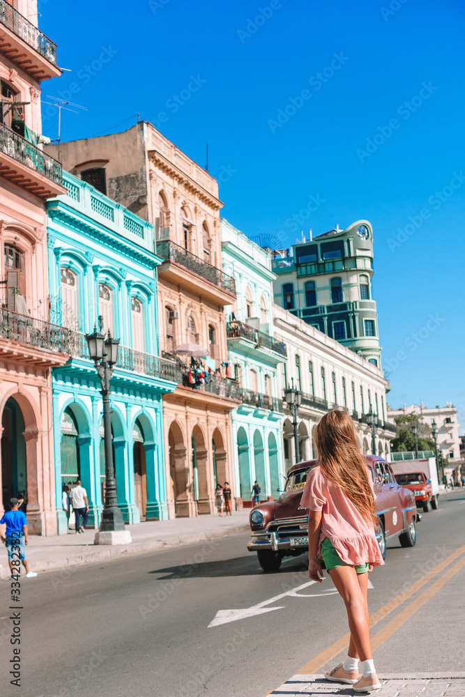 Naklejka premium Tourist girl in popular area in Havana, Cuba.