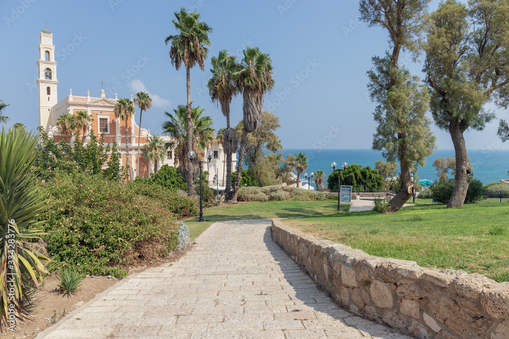 Stone Pathway Leading to St. Peter's Church in Old Jaffa, Israel with Mediterranean Sea in Background Stone Pathway Leading to St. Peter's Church in Old Jaffa, Israel with Mediterranean Sea in Background