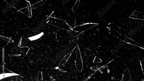 Super Slow Motion Shot of Real Glass Break at 1000 fps Isolated on Black Background.