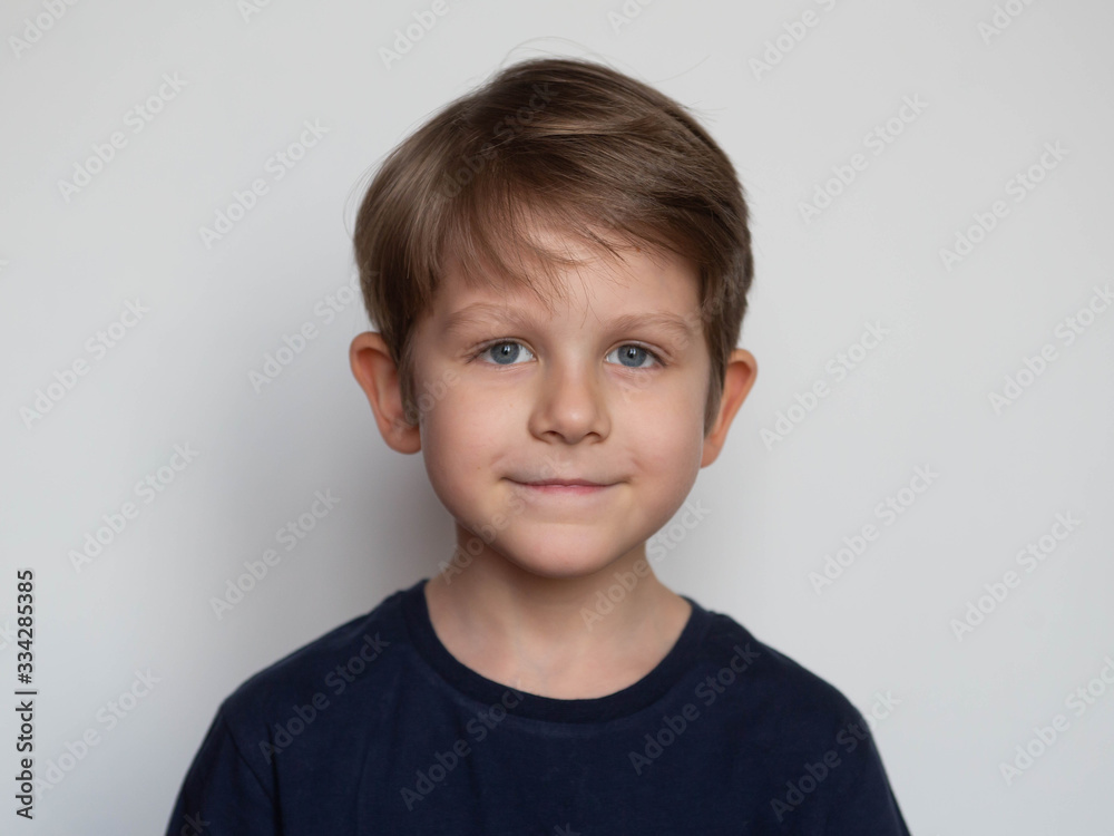 Portrait of a cute smiling preschooler boy on white background Portrait of a cute smiling preschooler boy on white background