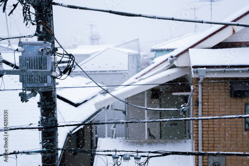 Snow falling on residential area / Tokyo, Japan