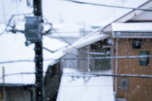 Snow falling on residential area / Tokyo, Japan