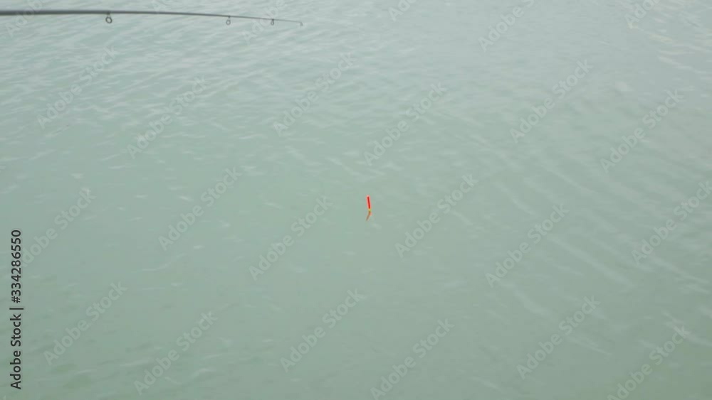 Sea fishing rod float in the water Sea fishing rod float in the water