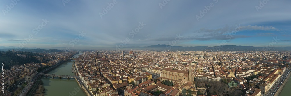 Aerial panorama of Florence at sunrise, Firenze, Tuscany, Italy, cathedral, river, drone pint view, mountains is on background