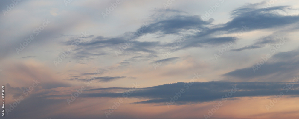 Defocus. Dramatic spring sky sunset. Sunset in the sky as a background.