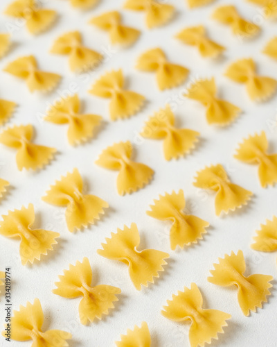 Pasta, durum wheat pasta in the form of bows, food pattern, top view, copy space flat lay