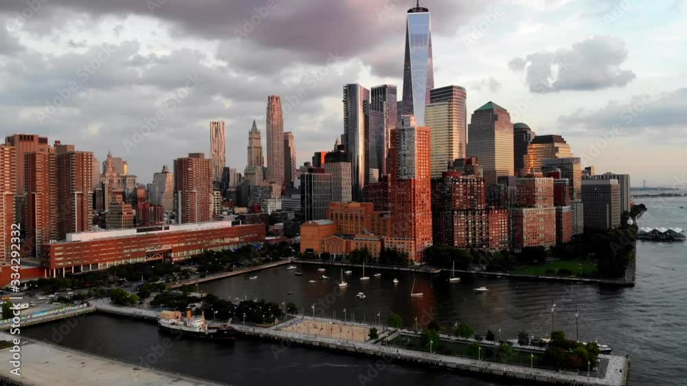 Aerial view from helicopter tour of high-rise buildings with contemporary architecture in business center, bird's eye of tall modern skyscrapers near Hudson river in big city