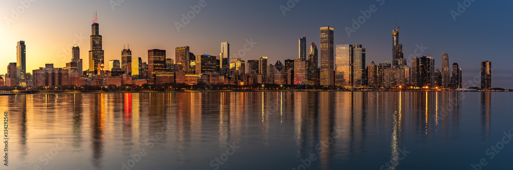 Chicago Skyline Cityscape at night with lake in front and blue sky with cloud, Chicago, United state. Chicago Skyline Cityscape at night with lake in front and blue sky with cloud, Chicago, United state.