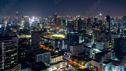 Bangkok business shopping district city center above Ratchadamri and Ratchaprasong area, with buildings and skyscrapers, during night, zoom in – Time Lapse photo