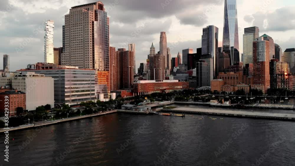 Aerial view from helicopter of high-rise buildings with contemporary architecture in business center, time lapse effect of landscape with tall modern skyscrapers during day time Aerial view from helicopter of high-rise buildings with contemporary architecture in business center, time lapse effect of landscape with tall modern skyscrapers during day time
