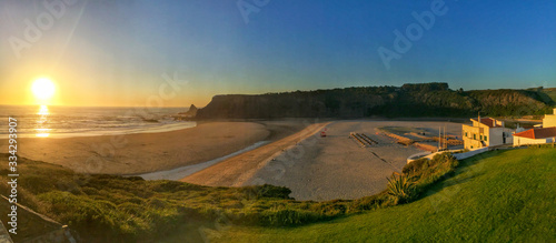 Photography Panoramic view from the cliffs to surfer beach Praia de Odeceixe in the evening