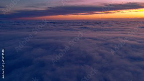 Above the clouds at sunset