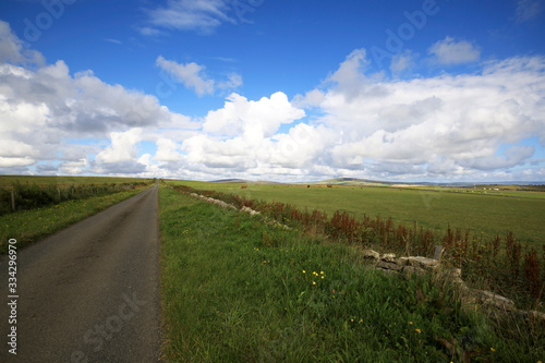 Orkney  Scotland   UK - August 09  2018  A typical road in the Orkney islands  Orkney  Scotland  Highlands  United Kingdom