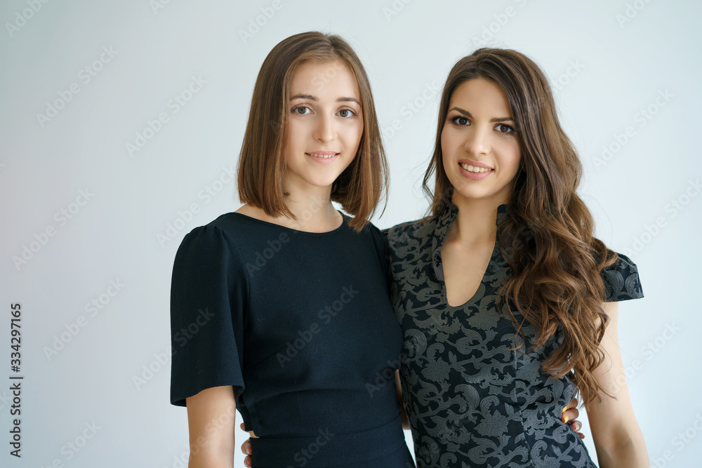 Two happy business women smile in the background